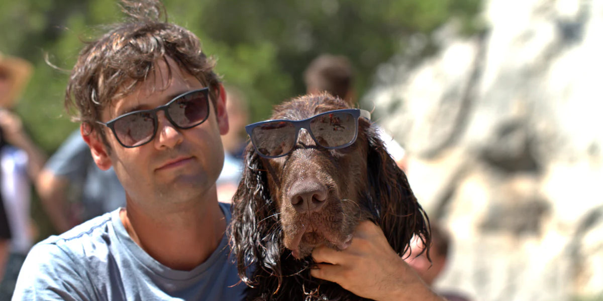 Man and dog wearing sunglasses