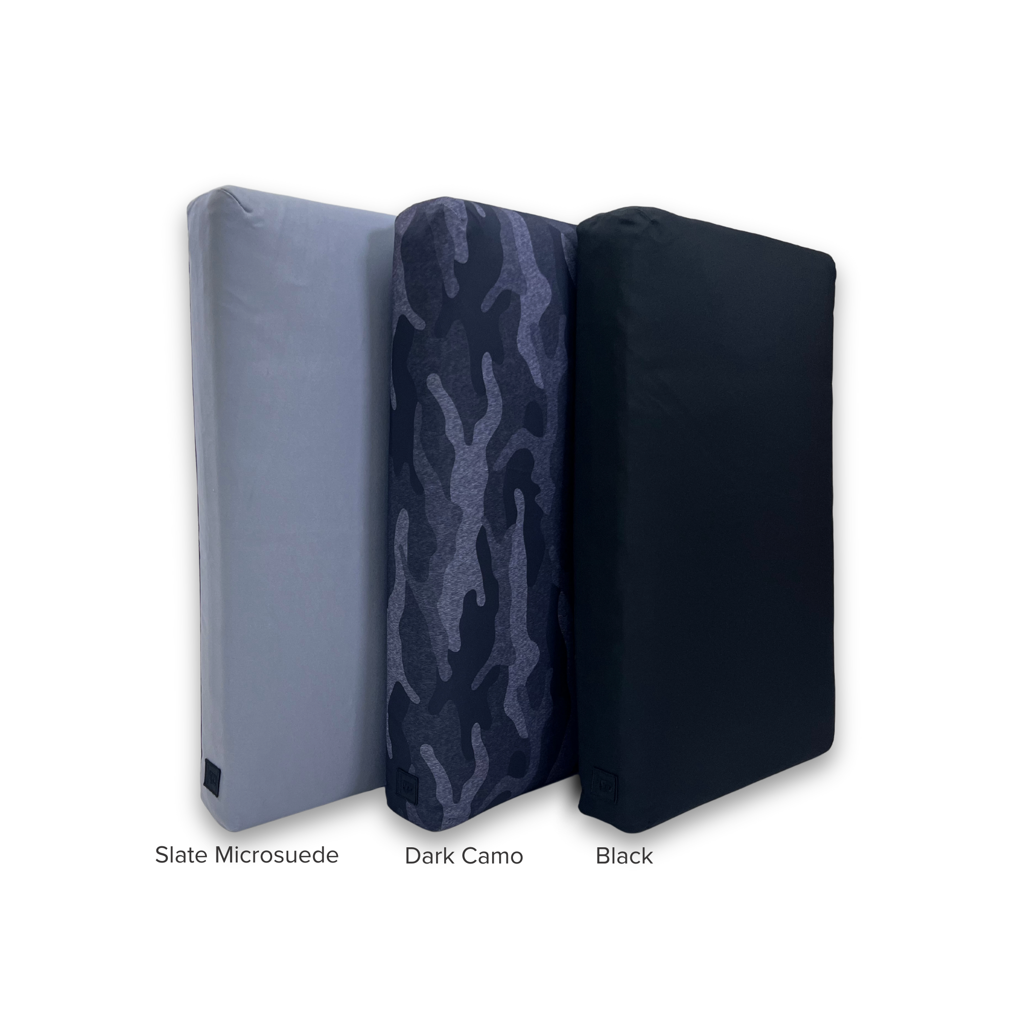 Stack of three dog beds displaying microsuede gray, dark camo, and black color bed covers.