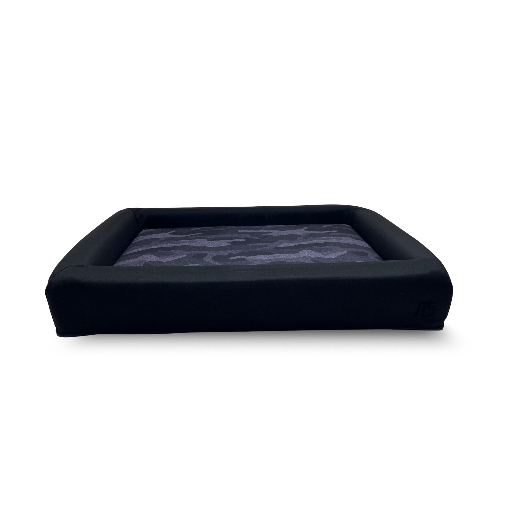 Dark Camo waterproof dog bed with black bolster and removable washable covers.