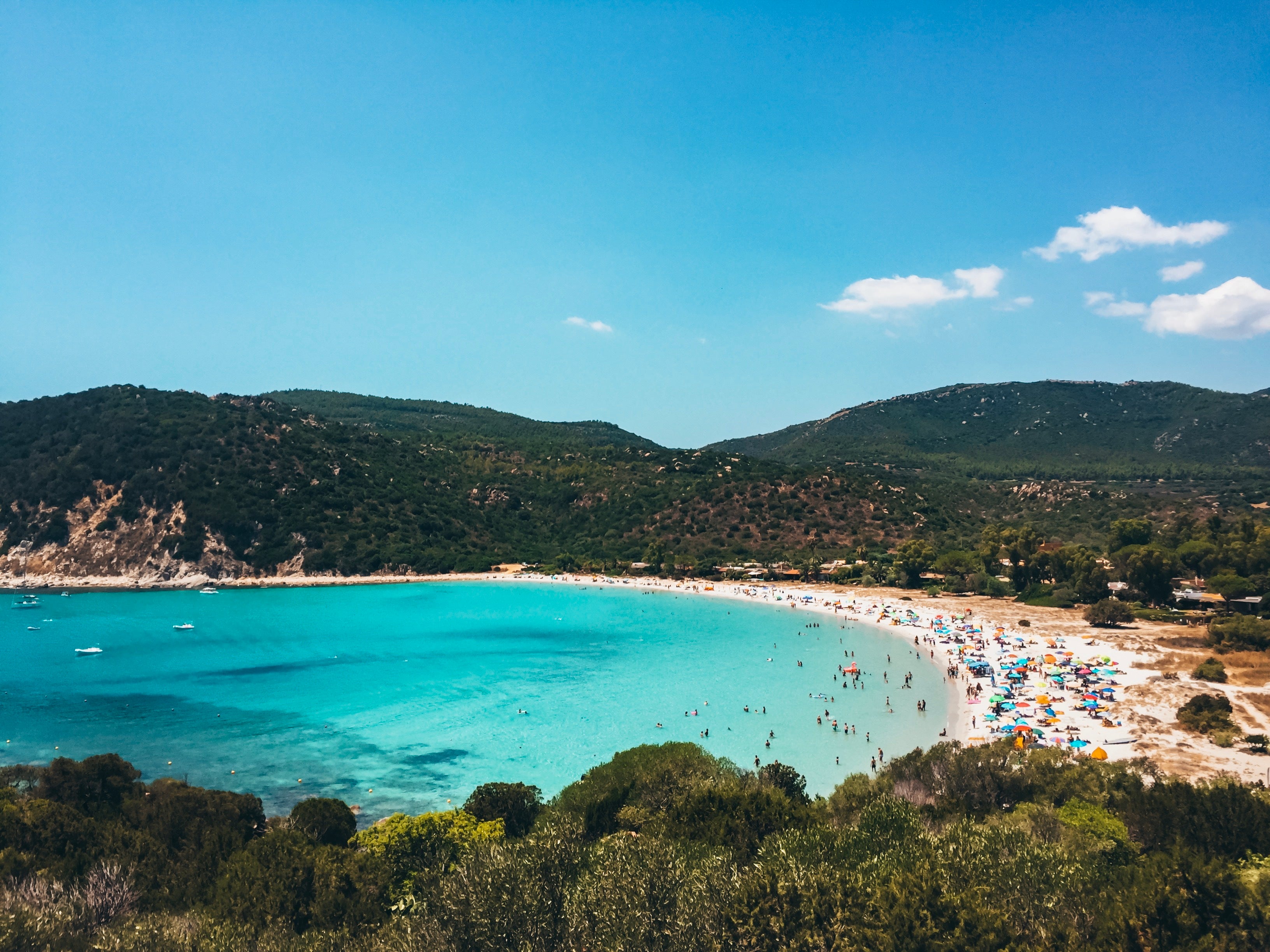 blue-water-bay-with-busy-beach.jpg