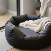 Round Dog Bed  with cream color blanket in a modern bed room with natural light